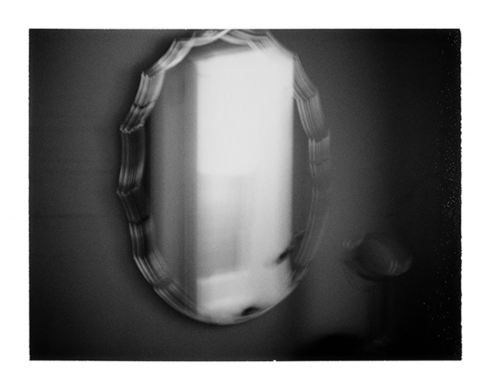 photograph of a mirror on a dressing table by Alan Ostreicher